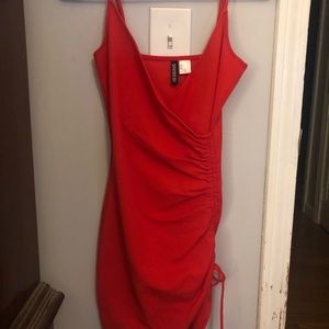 Ruched red a-symmetrical mini dress